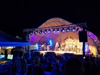 A large DAGB Series™ fabric building from Alaska Structures® is utilized by the To’Nanees’Dizi Local Government in Tuba City during the Western Navajo Fair, providing a versatile space for outdoor concerts and performances.