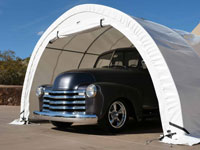 A classic truck is protected from harsh weather conditions under a WeatherPort® Carport, ensuring its preservation year - round