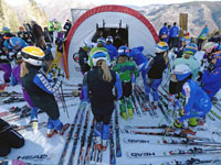An engineered fabric building from Alaska Structures® with custom - printed logos serves as the ideal WeatherPort® Start Gate for skiing competitions at Aspen Snowmass