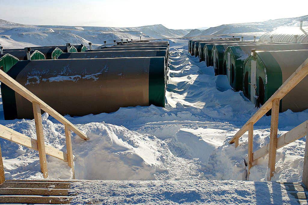 two rows of mining camp housing in snow