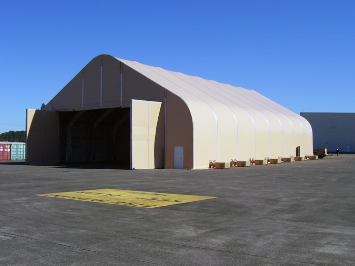 DAGB series gable truss aircraft hangar at airfield.