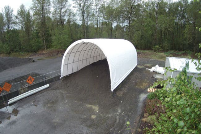 A SQ Series™ fabric building from Alaska Structures® creates an ideal temporary sand storage facility.