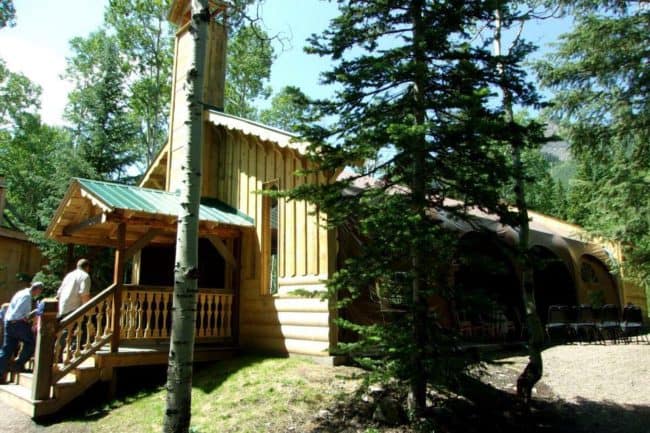 Alaska Structures church builldings HGB fabric building An open-air church with a custom-built entryway and wood façade utilizes a WeatherPort® fabric building (Jubilee Series™) from Alaska Structures®.