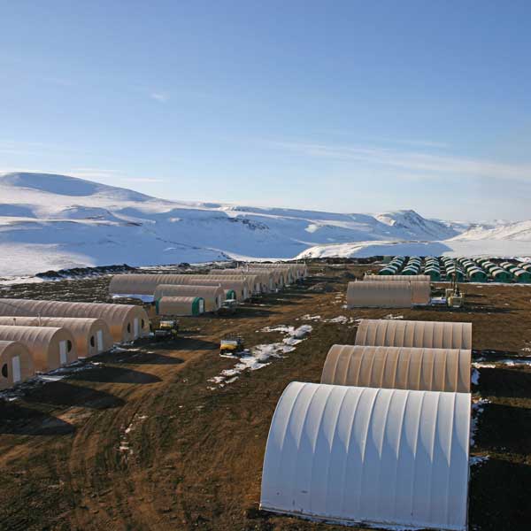 Tents and machines on a snowy mountain