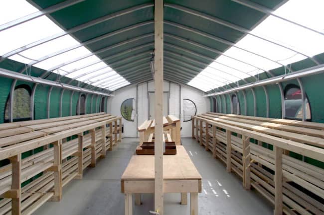 Alaska Structures core shack core logging structure A core shack and core logging facility using a GB Series™ fabric building from Alaska Structures®, featuring skylights for natural lighting during the day