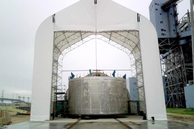 Alaska Structures DAGB fabric building for fabrication facility A raised DAGB Series™ fabric building from Alaska Structures® offers a weather - protected workspace for applying corrosion - resistant products to a large tank, enabling faster repairs and reducing operational downtime.