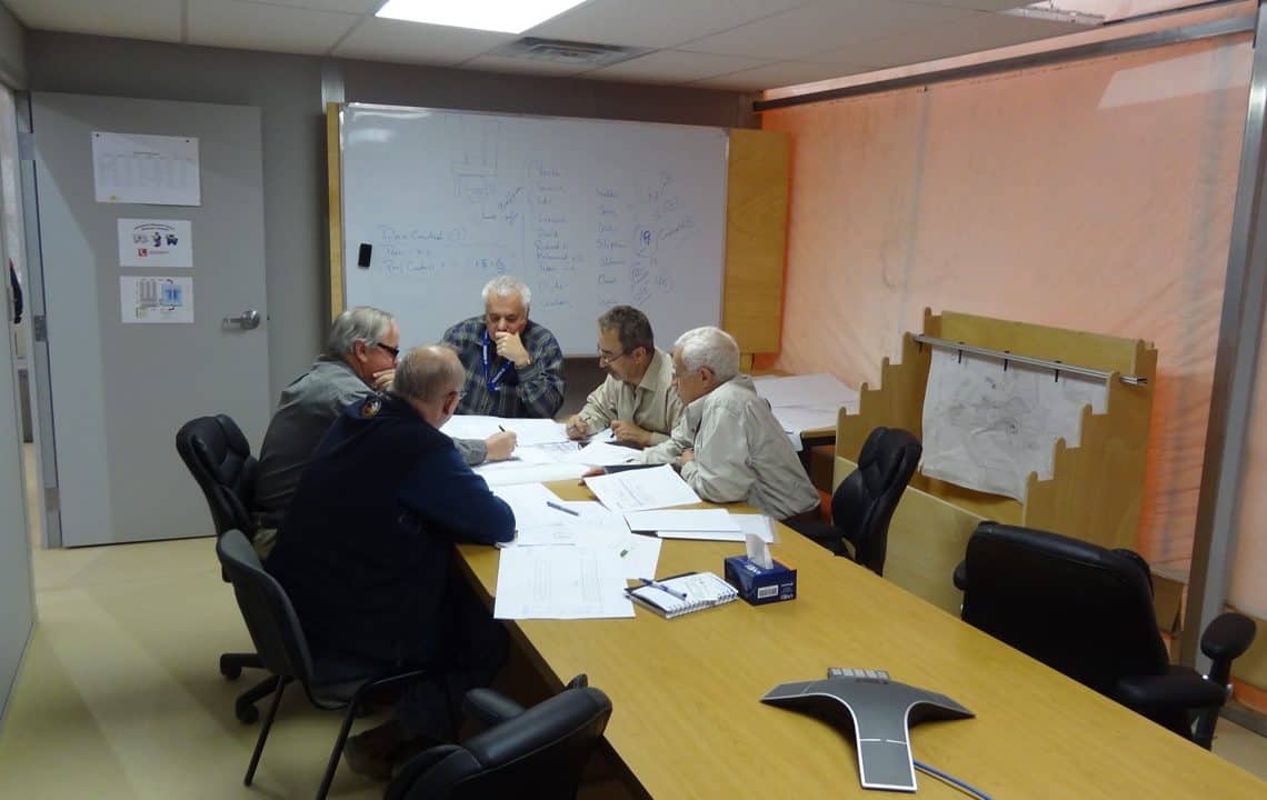 An onsite modular office, utilizing an HGB Series™ fabric building from Alaska Structures®, features customer-installed walls to create private offices and conference rooms, facilitating efficient management of a remote mining site.