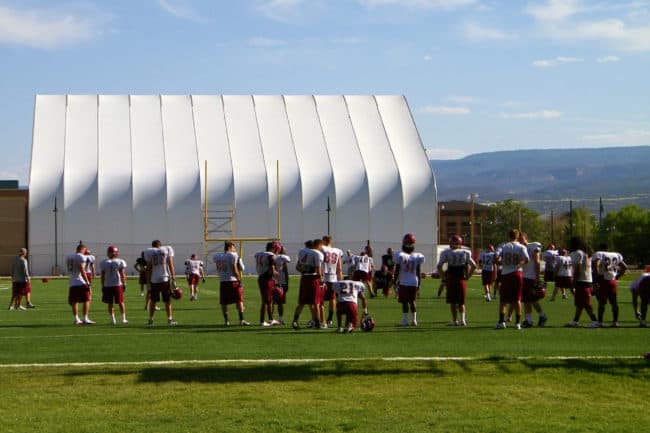 alaska-structures-dagb-fabric-building-for-school-gymnasium-1 A large fabric building from Alaska Structures® offers students a safe indoor space to train for sports and athletic teams when outdoor weather conditions are unfavorable or unsafe.