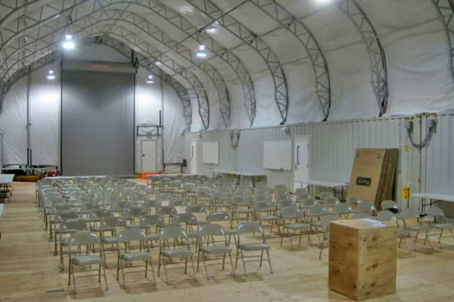 Alaska Structures DAGB fabric building on containers for workshop training facility A DAGB Series™ fabric building anchored to office containers is a great solution for creating multipurpose, industrial work buildings with onsite offices.