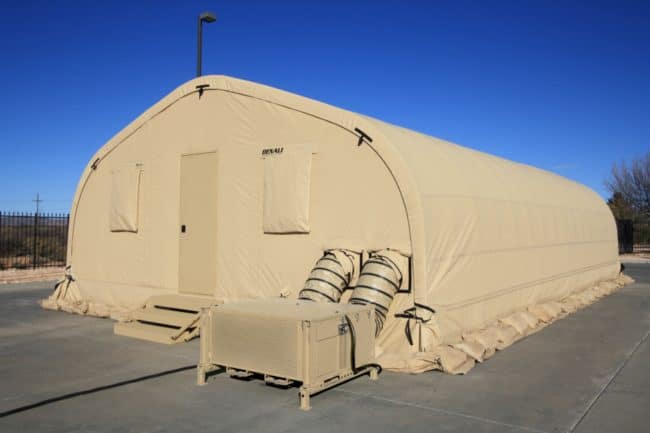 Alaska Structures Denali modular classroom HGB fabric building for high school The exterior of the modular classroom in Saipan features an HGB Series® fabric building from Alaska Structures®, equipped with a raised modular flooring system and a 5-ton Alaska ECU® (environmental control unit) for optimal comfort and climate control.