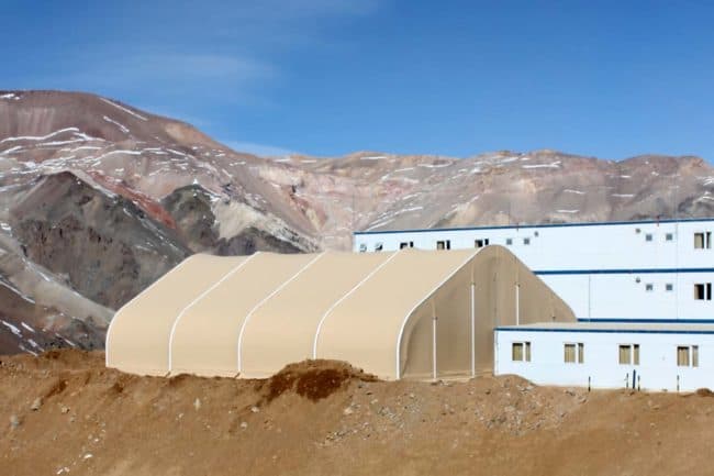 Alaska Structures dining facility for mining camp exterior A high-altitude mining operation in Chile utilizes a large prefabricated building from Alaska Structures® as a dining hall, providing a durable and comfortable space to feed workers and crews.