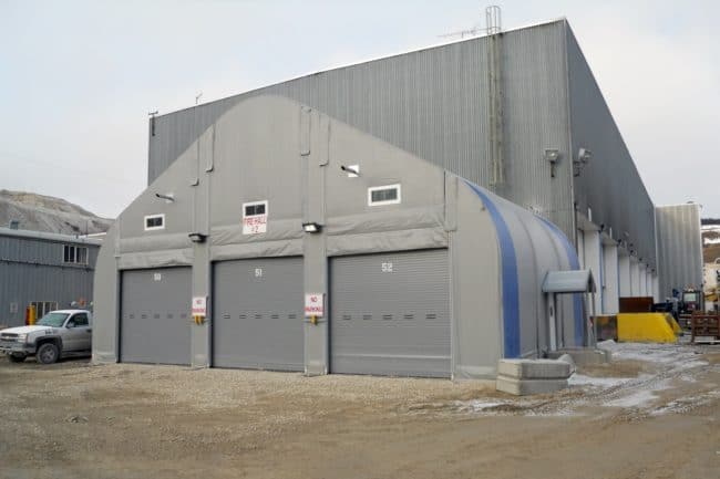 Alaska Structures fire station buildings A fire hall at a remote mining operation utilizes a DAGB Series™ fabric building from Alaska Structures® to securely store emergency response vehicles, ensuring rapid access in case of emergencies.