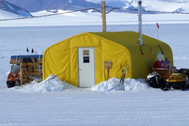 Alaska Structures GB fabric building mechanical workshop A polar research camp utilizes an engineered fabric building from Alaska Structures® as the "mechanical tent," dedicated to maintaining life - saving equipment, infrastructure, and mission - critical tools.