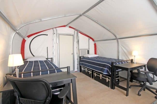 Alaska Structures GB modular building for workforce housing 2-person sleeper The interior of a 12' wide x 20' long 2-person sleeper, using a GB Series™ fabric building from Alaska Structures®, features straight walls for optimal space utilization and a wall-mounted HVAC system for a comfortable living environment.