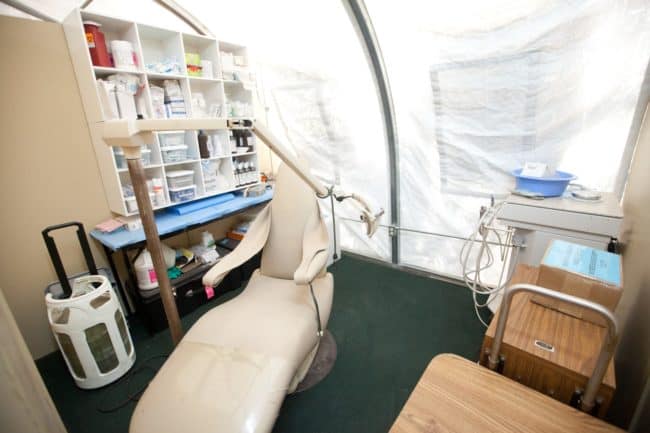 After the 2010 Haiti Earthquake destroyed the local hospital, a medical and dental facility was constructed using an HGB Series™ fabric building from Alaska Structures®, providing essential healthcare services to the community.