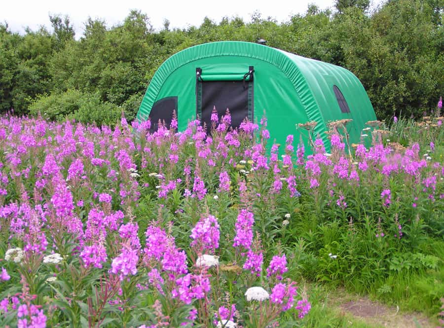 An XT Series™ fabric shelter from Alaska Structures® provides remote wilderness resorts, glamping sites, fishing camps, hunting camps, and guide outfitters with a safe, reliable, and easily transportable solution for guest accommodations.