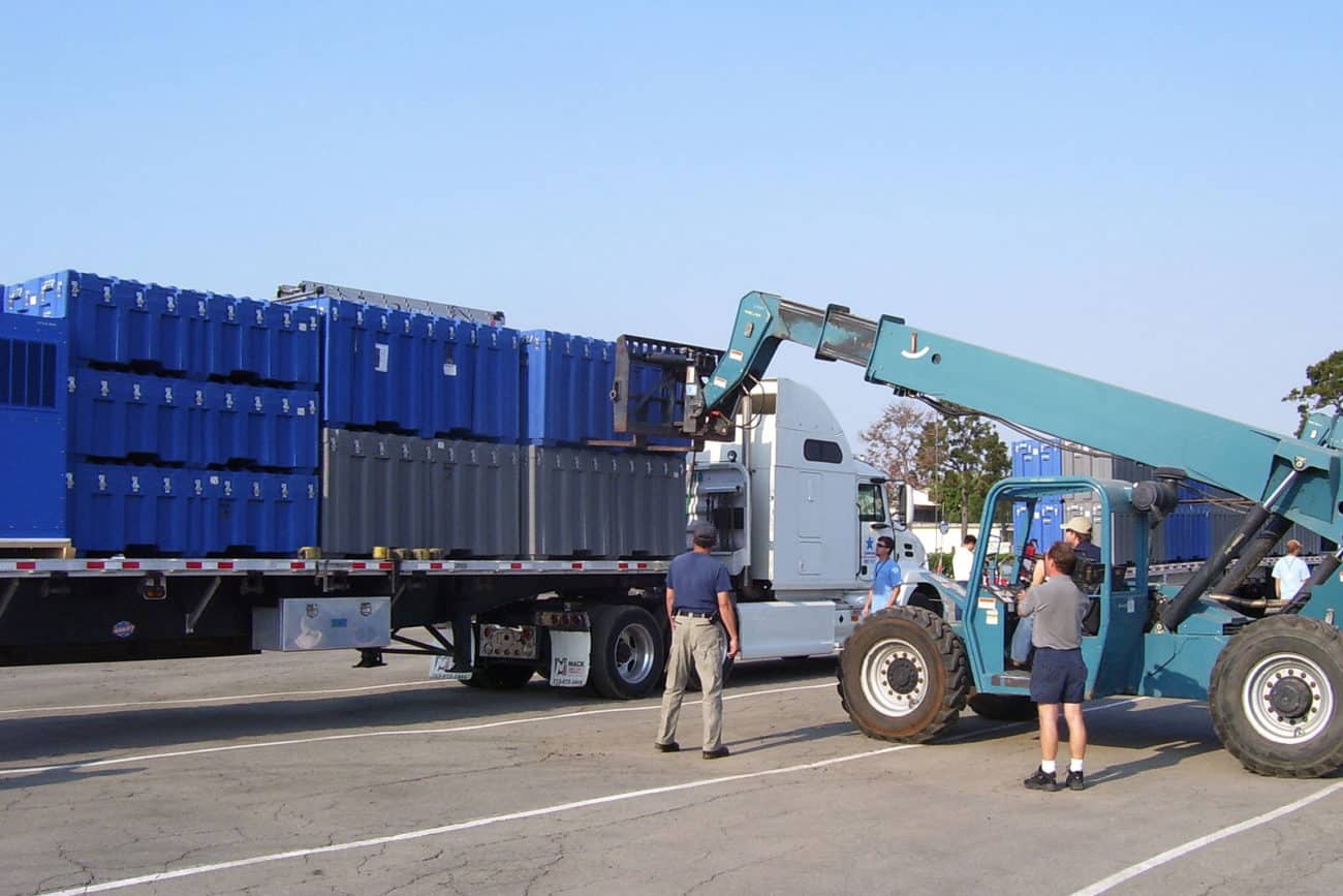 Alaska Structures small and large Rotomold Containers on flatbed truck