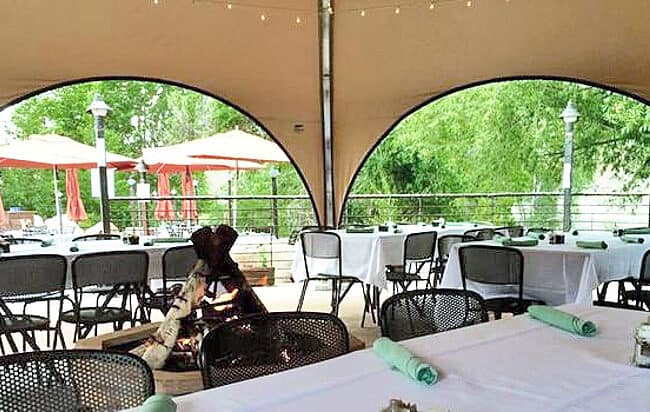 weatherport-octopae-35-diameter-rivers-edge-bar-and-restaurant-salida-colorado-2 Interior of a 35’ diameter Octopae™ (8-sided WeatherPort® Canopy) used for outdoor dining at Rivers Edge Bar and Restaurant in Salida, Colorado.
