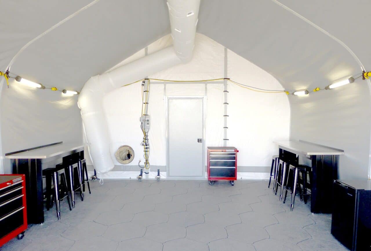 weatherport-portable-garage-hgb-series-5 Interior of a WeatherPort® portable garage using an HGB Series™ fabric building shown with insulation and a tracked liner, HVAC and lighting system, and modular flooring