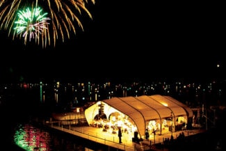 Stage cover on floating dock using Jubilee Series fabric building from AlaskaStructures