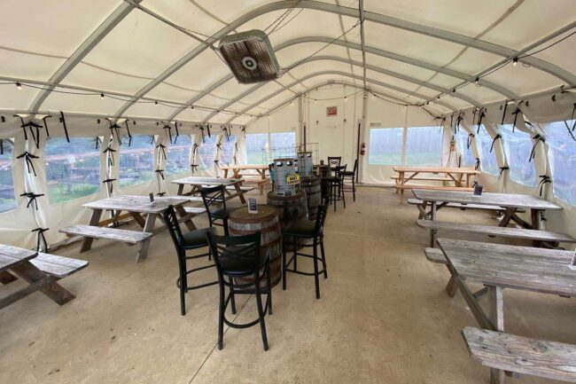 open-air-lunch-tent-from-alaska-structures-6 The interior of an open-air lunch tent with roll-up side curtains made using a WeatherPort® Jubilee Series™ fabric structure.