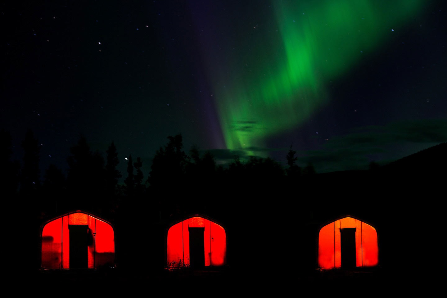exploration-camp-from-alaska-minerals-using-gb-series-fabric-buildings-from-alaska-structures-5 Exploration camp from Alaska Minerals shown under the aurora borealis, highlighting GB Series™ fabric buildings from Alaska Structures® in remote northern conditions. The camp provides dependable shelter and operational support for exploration crews working in harsh, cold-weather environments.