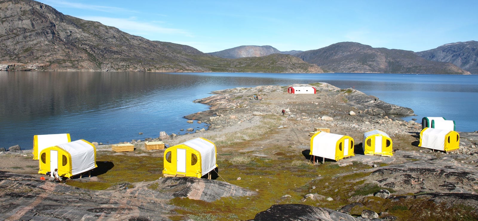 exploration-camp-in-northern-greenland-using-gb-series-fabric-buildings-from-alaska-structures-1 An exploration camp in northern Greenland supporting remote mineral exploration activities in Arctic conditions. The camp features GB Series™ pre-engineered fabric buildings from Alaska Structures®, providing durable, rapidly deployable infrastructure for workforce housing and field operations in isolated, logistically challenging environments.