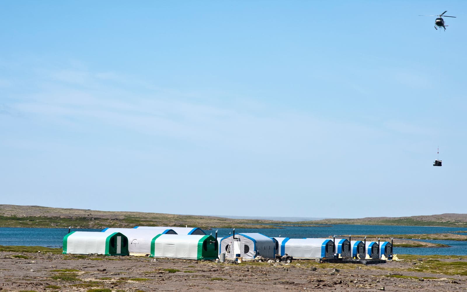 fly-in-camp-belcher-island-canada-1 Fly-in camp supporting mineral exploration on Belcher Island, Canada, featuring GB Series™ pre-engineered fabric buildings from Alaska Structures® deployed in a remote Arctic environment.