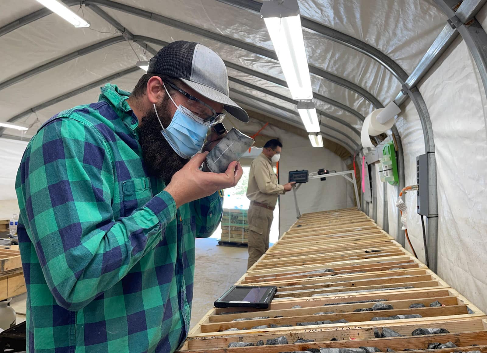interior-of-a-core-logging-facility-at-an-exploration-camp-from-alaska-minerals-using-gb-series-fabric-buildings-from-alaska-structures-4 Interior of a core logging facility at an exploration camp operated by Alaska Minerals, where geological teams analyze and document drill core samples. The core logging facility utilizes a GB Series™ fabric building from Alaska Structures®, providing a controlled environment for accurate data collection and sample evaluation.