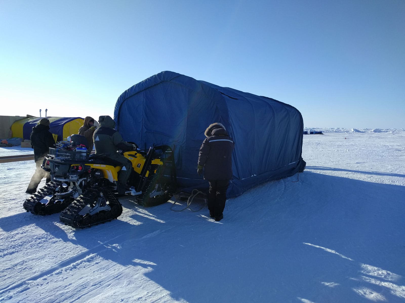 relocating-a-rapidly-deployable-field-office-on-snow-skids-for-ICEX-2016-using-a-snowmobile-1 Rapidly deployable GB Series™ field office deployed on Arctic sea ice during ICEX 2016, providing a heated, insulated workspace for mission coordination, engineering operations, and field support in extreme subzero conditions. Mounted on snow skids, the shelter could be quickly positioned and relocated across the ice using a snowmobile as mission requirements changed.