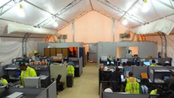 Interior of an EPCM office with hard-wall partitions inside a fabric building at a West African mining camp