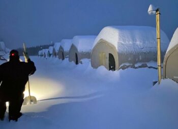 GB Series fabric buildings under heavy snow at an Alaska Minerals exploration camp