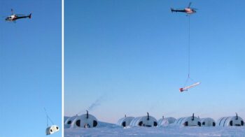 Helicopter sling-loading an SQ Series fabric shelter at the Chidliak Diamond Project fly-in camp, Baffin Island